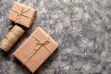 Gifts and twine for grey grunge abstract urban extured wall background gray suitable for use in classic design. Marble background. Loft style design ideas.