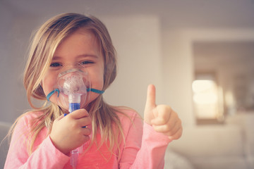 Little girl using inhaler. - obrazy, fototapety, plakaty