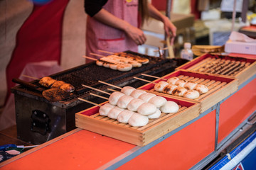 Street foods being prepared in the market. Japanese street foods are very delicious and comes in different flavors. They comprise mostly of seafoods.