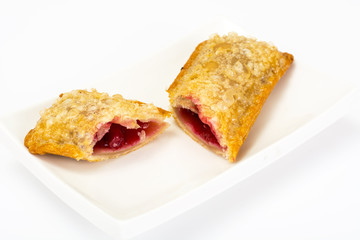 Puff pastry with fresh cherries on a white