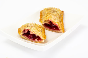 Puff pastry with fresh cherries on a white