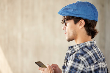close up of man texting message on smartphone