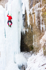 The climber climbs on ice.