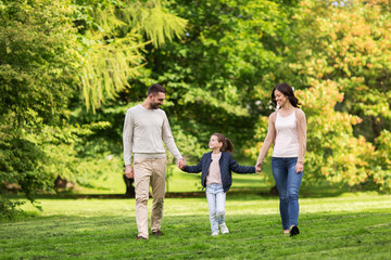 Naklejka na ściany i meble happy family walking in summer park