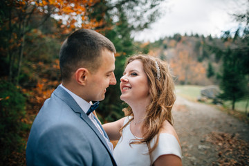 wedding couple walking in the mountains