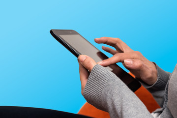 woman hands touch with finger on tablet. blue background