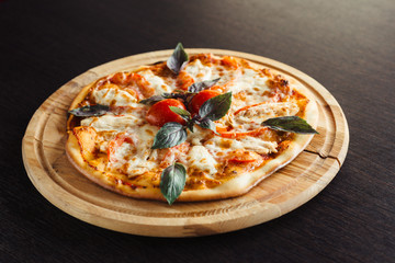 Italian pizza with chicken on the Board