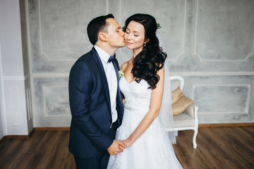 Fototapeta premium Wedding photo shoot of the newlyweds in a beautiful Studio inter