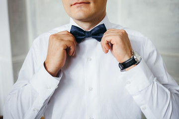 Portrait of the groom in the Studio.