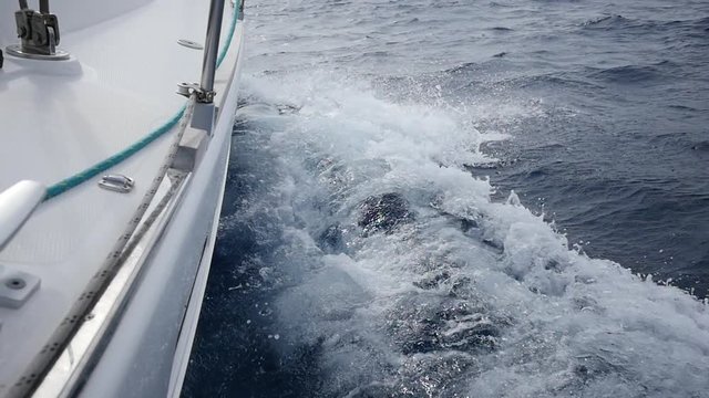 Aboard and handrails yacht on a background of sea waves in Greece. Regatta. Adventures in the ocean. Slow motion.