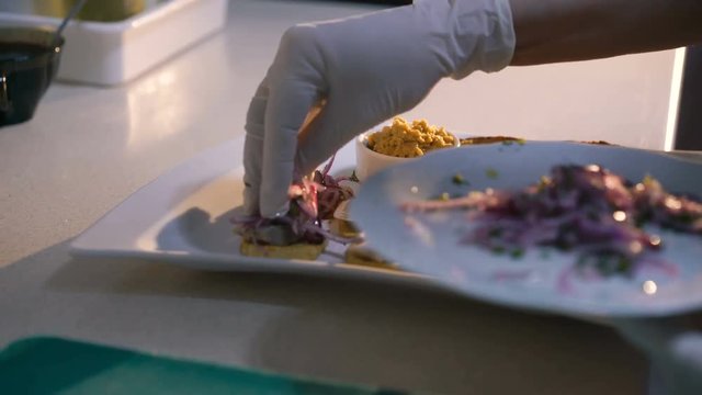 Master chief making dish presentation in 4K