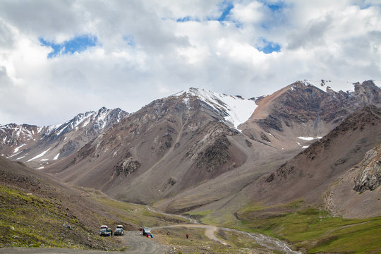 Beaultiful mountain landscape with cars and road