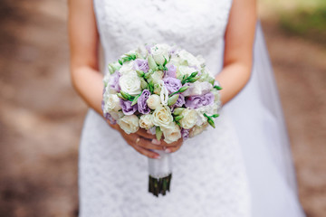wedding bouquet bride with purple flowers