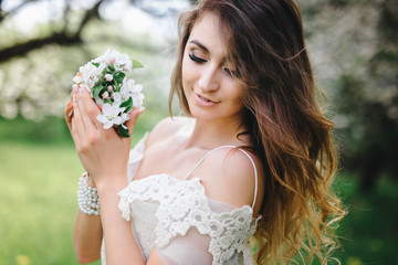 portrait of a beautiful girl in the apple orchard