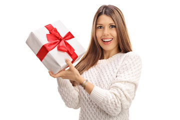 Delighted woman holding a present
