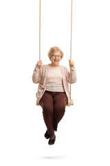 Happy elderly woman on a swing
