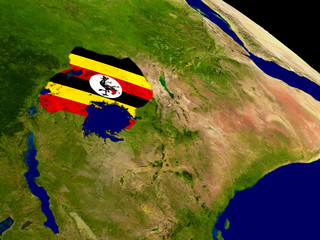 Uganda with flag on Earth