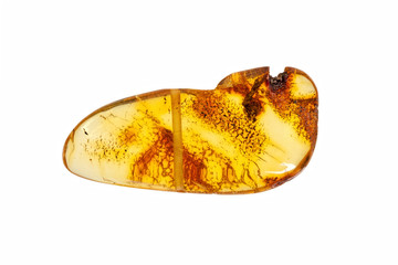 Yellow amber stone close up on a white background.