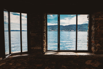Fototapeta na wymiar Nature behind the window. Hills, water and sky. Life on the other bank.