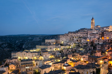 Naklejka premium Matera (Basilicata Italy) Sasso Barisano at twilight