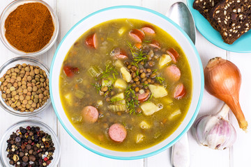 Hot and thick soup with lentils and sausages