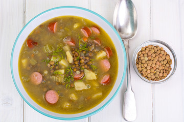 Hot and thick soup with lentils and sausages