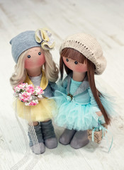 Two handmade rag dolls - blonde and brown-haired