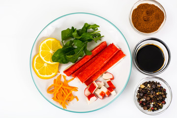 Crab sticks, lemon and arugula