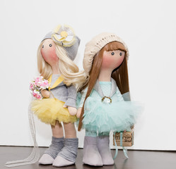 Two handmade rag dolls - blonde and brown-haired