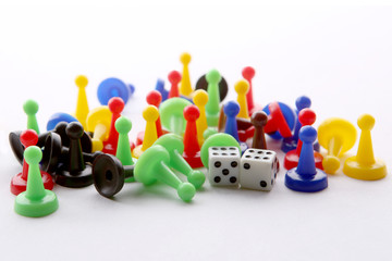 Colorful play figures and dices with double six. Board game pieces and dices.
