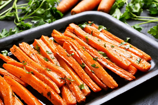 Fried carrots with green herbs