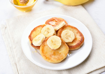 Pancakes with curd cheese and banana slices