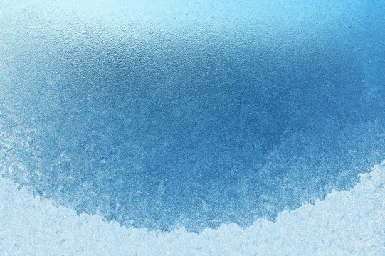 Frozen glass window on the balcony, absolutely nothing can be seen through the frozen window, can be used as a background image in cool colors