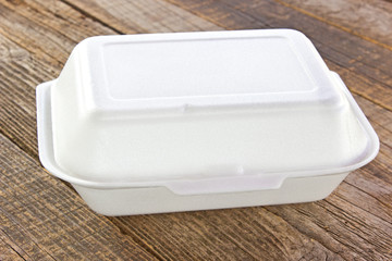 Styrofoam box for food on wooden table