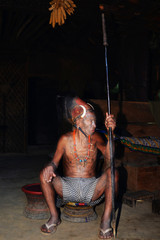 Portrait of the warrior from the tribe of Konyak headhunters in the Nagaland state, India