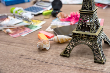 Eiffel Tower with euro money on desk. travel concept.
