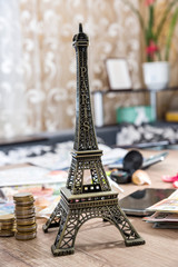 Eiffel Tower with euro money on desk. travel concept.