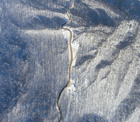 Aerial view of winter mountain road.