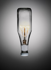 Ketchup bottle with light bulb in it against graduated grey background
