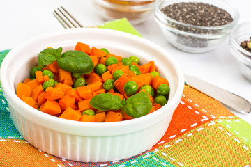 Carrots and green peas on a couple of Diet