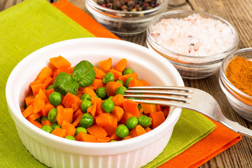 Carrots and green peas on a couple of Diet