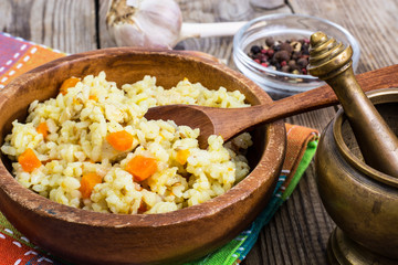 Pilaf, rice, meat, carrots, garlic