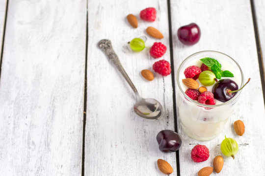 Homemade yogurt with berries and almonds. A healthy natural dess