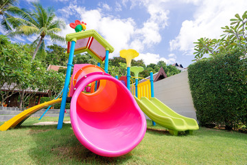 Colorful children playground in tropical resort.