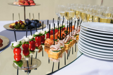 wedding reception. Table with snacks and glasses of champagne in a restaurant