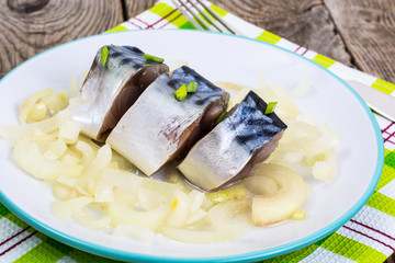 Fish appetizer: slices marinated mackerel.