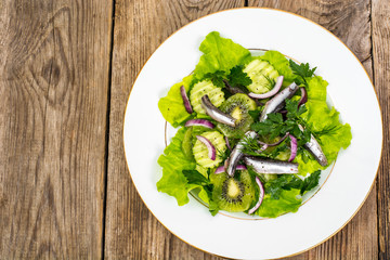 Fresh vegetable salad with anchovies