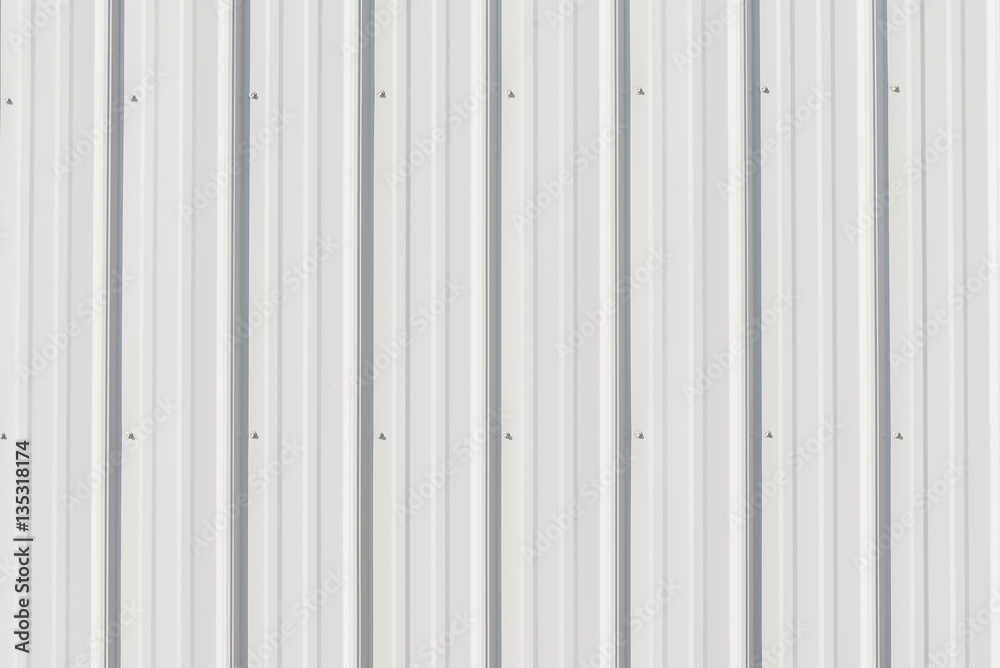 Wall mural light gray metal siding with shadows