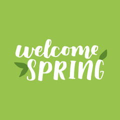 Vector seasonal greeting card of hand-written spring brush lettering. Spring collection white ink and green floral elements on green background. Trendy greenery color of spring 2017.