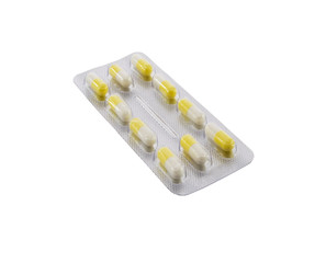 Many different color tablets and pills isolated over white backg